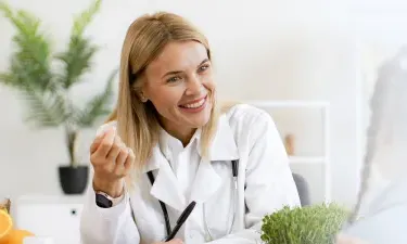 Nevada family nurse practitioner smiling with pediatric patient during appointment