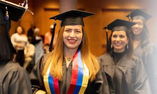 Herzing Iowa Online BSN Student Smiling at Graduation Ceremony 